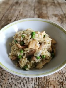 A bowl full of Chicken, bacon and mushroom risotto