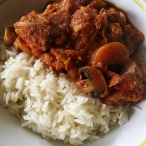 Slow Cooker Pork Casserole - A bowl of casserole and rice