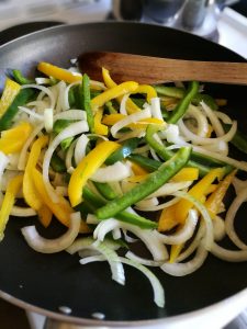 Stir fry the veg for chicken fajitas