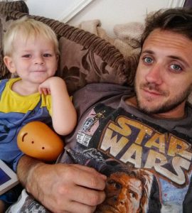 I wrote a post, forgot the title - Dad wearing a star wars t-shirt and a little boy with a yellow and blue top