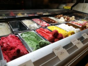 Heavenly Desserts Colchester - A big glass freezer counter with lots of coloured ice creams inside. 