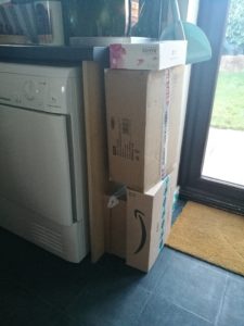 Living With A Blogger - 4 boxes stacked on top of each other 