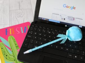 32 Things I've Learnt - a laptop showing Google with a pen and notepad next to it.
