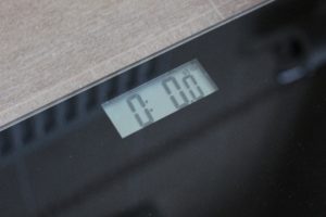 Dieting Myths - black glass scales set to zero