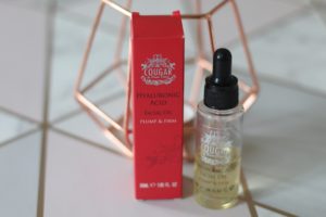 Skincare in your early 30's - A red box with a silver logo and a small clear bottle with a black dropper top