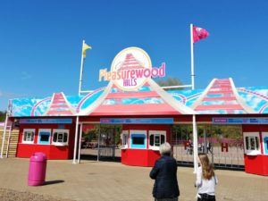 Frugal Family Days Out - Pleasurewood Hills sign on top of red and blue entrance gates