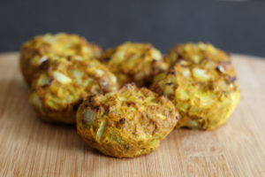 Baked Sweet Potato Onion Bhajis - oval bhajis sat ona wooden board