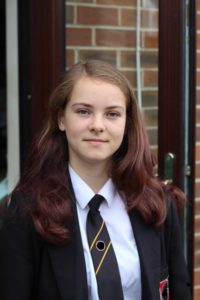 The First Year Of High School - A girl in her school uniform.