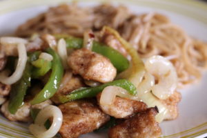 Fakeaway Salt And Pepper Chicken - A plate of chicken and vegetables. 