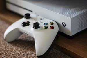 5 truths about living with a gamer - a white Xbox One controller sat in front of a white Xbox