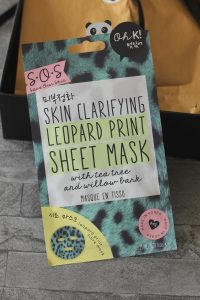 A blue leopard print packet with large writing and a cute panda peeping on the top.
