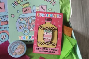 Sugar & Sloth Tiny Party Club enamel pin badge - A little tequila worn wearing a flower crown.