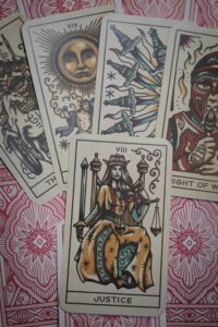 What is Wicca? Tarot cards layed out with Justice on top.